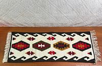 Full view of table runner showing design and overall condition