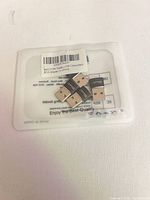Six EasULT USB-A Bluetooth adapters on top of packaging card