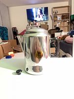 Full view of percolator with loose knob piece beside it