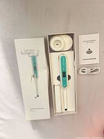 Camera, cover attachment, manual and USB cable in box