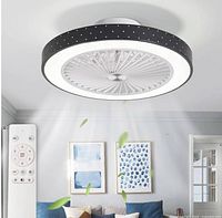 Marketing image showing installed ceiling fan and remote