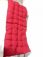 full view of red tufted sleeping mat laid flat