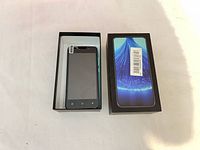 Smartphone in tray with box lid