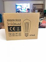 Front of box showing Edison Bulb ST64 Model 6 pack illustration
