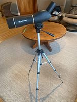 Meade spotting scope mounted on tripod side view