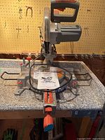 Front view of Terratek sliding mitre saw on work surface
