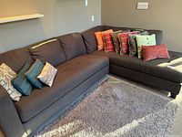 Both couches forming an L-shape with cushions placed