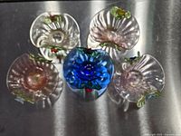 Top view of all five baskets showing colours and flower handles