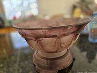 Side view of bowl on stand showing cloud glass swirl