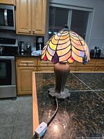 Full view of stained glass lamp on countertop