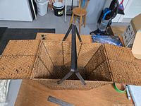 Basket open showing interior, split lids and metal handles