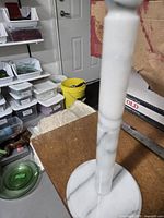 Entire holder standing on table showing post and base