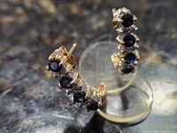 Front view showing sapphire and diamond settings and overall design