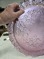 Top view showing floral relief pattern and color