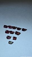 Group of 11 faceted sapphires showing size and mixed colors