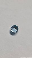 Top view of oval Swiss blue topaz gemstone