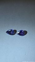 Both pear-cut tanzanites front view