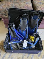 Entire snorkel set packed in carry case showing fins snorkels mask