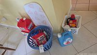 Full lot showing ironing board, baskets and detergent containers