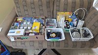 Overview of all electrical supplies and lighting accessories on couch