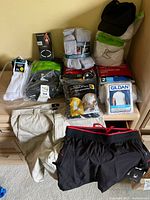 Overall lot with packs of socks, underwear, two shorts and cap