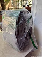 Front view of folded tarp in sealed bag