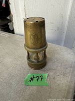 Full view of brass miners lamp front with crest