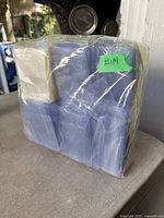 Front view of shrink-wrapped brick showing multiple clear and blue-tinted sleeve packs