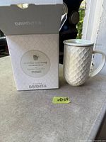 Box and mug shown together