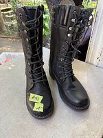 Front view of both boots standing upright, showing laces and toes