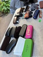 Overall view showing multiple eyeglass cases and eyewear