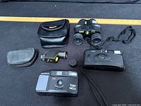 Full lot: binoculars with case, two cameras, monocular with pouch and cap