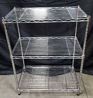 Front view of chrome wire shelving with three tiers