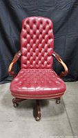 Full front view of red tufted leather office chair