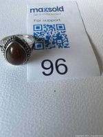 Front view of sterling silver ring with brown agate stone