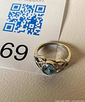 Ring overhead view showing blue topaz and Celtic design