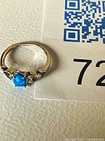 Ring top view showing blue opal cabochon in sterling silver setting