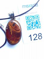 Close-up of oval jasper pendant showing stone pattern, bezel and bail marked 925 beside MaxSold tag