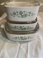 Three graduated casseroles stacked showing ivy pattern