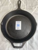 Top view of cast iron skillet showing overall shape, helper handle, pour spouts