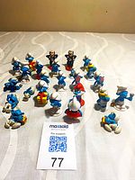 Full group of 25 Smurf and Gargamel figurines on tabletop