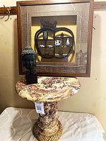 All three items together: marble table, wall shadowbox, Buddha head
