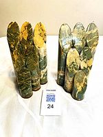 Front view showing both mariposite core bookends with lot tag