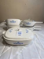 Group shot showing all three blue cornflower casseroles with lids