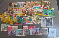 Overview of all 56 assorted cards spread on surface