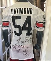 Back view showing DAYMOND name, 54 number and multiple autographs