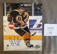 Full view of signed 8x10 Ray Bourque Boston Bruins photo with hologram and stickers visible
