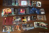 Wide view of multiple stacks of Star Trek trading cards arranged on table