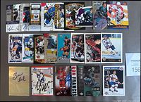 All 25 autographed hockey cards laid out