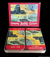 Open box showing two stacks of illustrated Convoy Battle Action cards